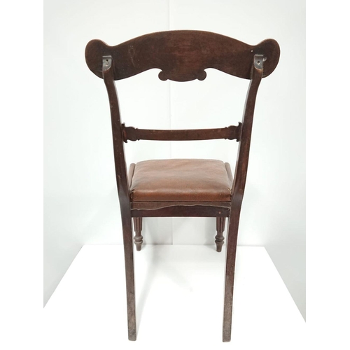 156 - AN EDWARDIAN MAHOGANY DINING CHAIR with rosewood veneer on top-rail, with each shoulder terminating ... 