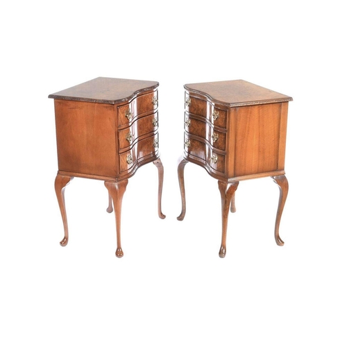 16 - A GOOD QUALITY PAIR OF WALNUT SERPENTINE SHAPED 3 DRAWER CABINETS / BEDSIDE PEDESTALS, each with a g... 