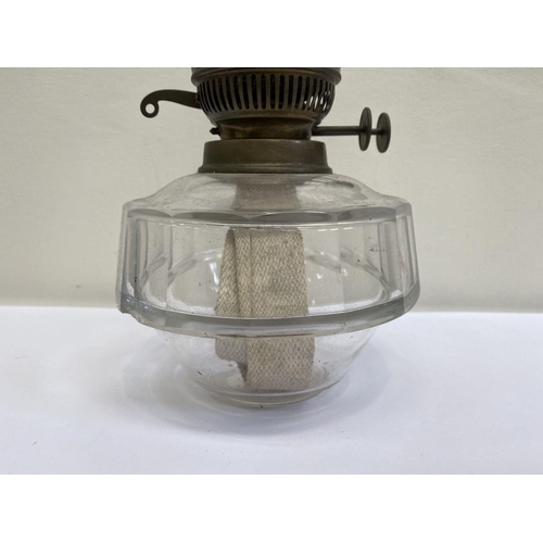 161 - A VINTAGE ENGLISH GLASS OIL LAMP, pressed and moulded glass with brass fittings. Thumb wheels marked... 