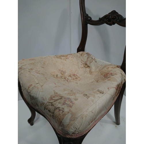 176 - A VICTORIAN WALNUT BALLOON-BACKED CHAIR, upholstered with floral design; scrolling acanthus motif on... 