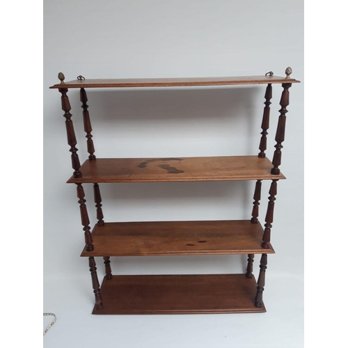 177 - A SET OF VICTORIAN MAHOGANY HANGING SHELVES, with four tiers supported by turned columns. Dimensions... 