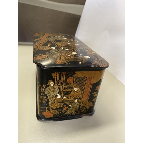 19 - AN EARLY 20TH CENTURY CHINOISERIE BLACK LACQUER AND GILT TEA CADDY, of rectangular form with rounded... 