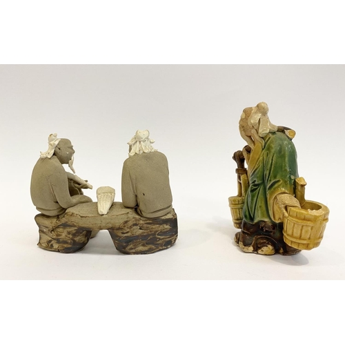 194 - A CHINESE CLAY SHIWAN FIGURINE, depicting two seated ‘mudman’ figures in traditional dress conversin... 