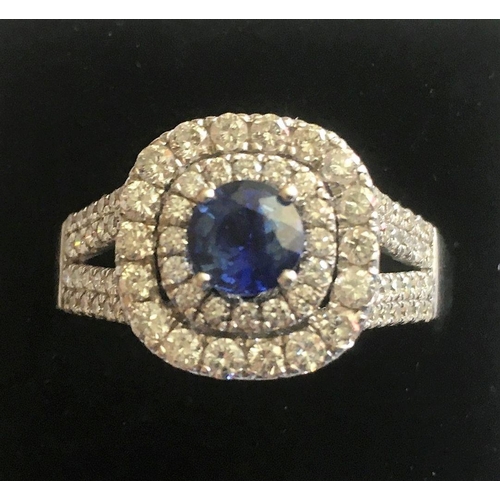 20 - A VAROUJAN DESIGNED TANZANITE & DIAMOND CLUSTER RING, a great ring with a centrally placed Tanzanite... 