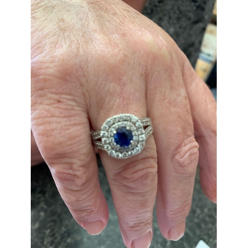 20 - A VAROUJAN DESIGNED TANZANITE & DIAMOND CLUSTER RING, a great ring with a centrally placed Tanzanite... 