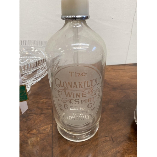 202 - A ‘CLONAKILTY WINE SPIRITS & BEER CO. CLONAKILTY’ ETCHED GLASS FLAGON ALONG WITH A WATERFORD CRYSTAL... 