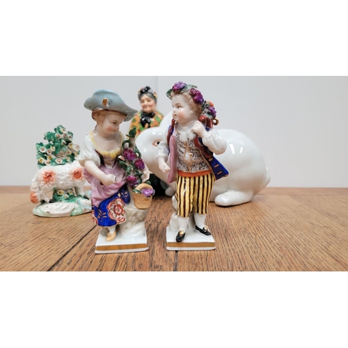 206 - A MIXED ORNAMENT LOT; includes; A Royal Doulton ‘Old Lavender Seller’, (ii) A pair of sheep, (iii) a... 