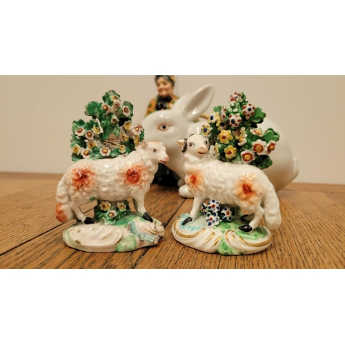 206 - A MIXED ORNAMENT LOT; includes; A Royal Doulton ‘Old Lavender Seller’, (ii) A pair of sheep, (iii) a... 