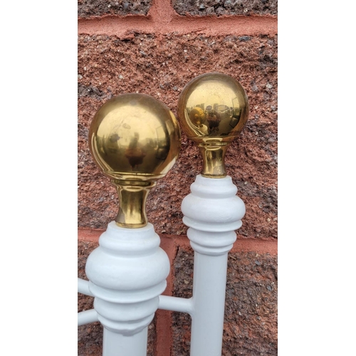 220 - TWO WROUGHT IRON BEAD HEADS, coloured white with polished brass tops. 136 x 94cm H x W