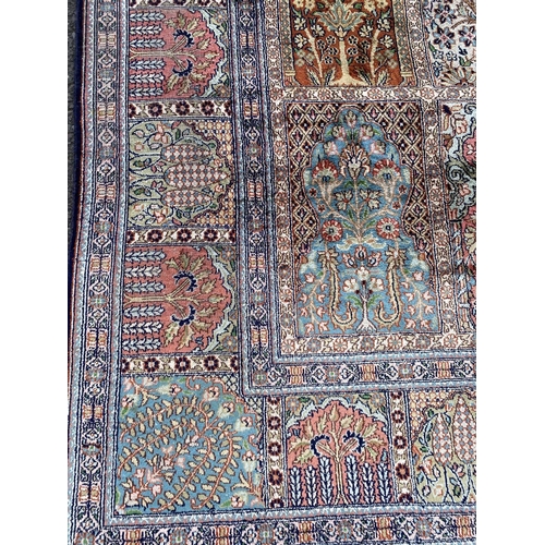 24 - A KASHIM SILK RUG, material: hand spun silk with natural organic dyes; design: this rug features a t... 