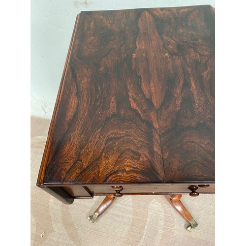 25 - A RECENCY ROSEWOOD DROP LEAF LAMP TABLE, on quatrefoil base on castors, dimensions: 42cm x 53cm x 69... 