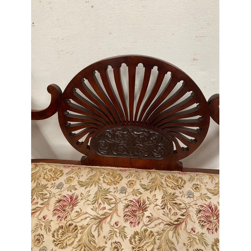 3 - A MAHOGANY FAN BACKED WINDOW SEAT, with upholstered seat, swept arms, engraved floral design to fan ... 