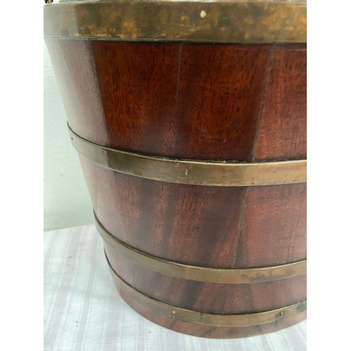 32 - A RECENCY MAHOGANY OVAL SHAPED BRASS BANDED PEAT BUCKET, with original liner and handle. Dimensions:... 