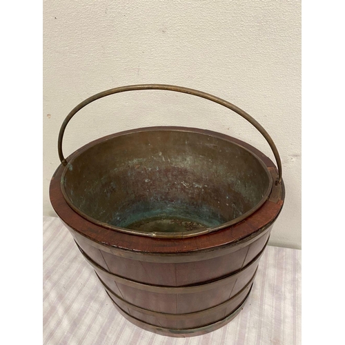 32 - A RECENCY MAHOGANY OVAL SHAPED BRASS BANDED PEAT BUCKET, with original liner and handle. Dimensions:... 