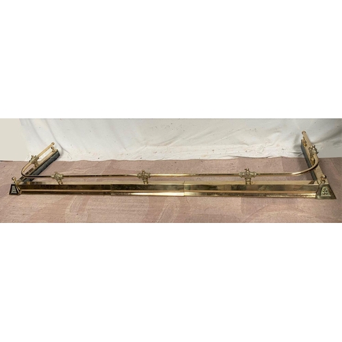 37 - A BRASS ADJUSTABLE FIRE FENDER, with decorative engraved finials, dimensions: 164cm opened; 153cm to... 