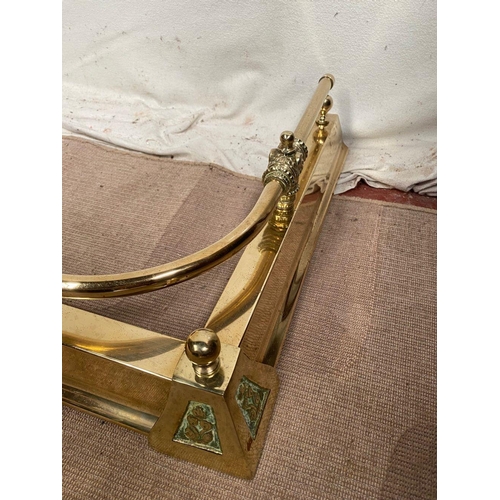 37 - A BRASS ADJUSTABLE FIRE FENDER, with decorative engraved finials, dimensions: 164cm opened; 153cm to... 