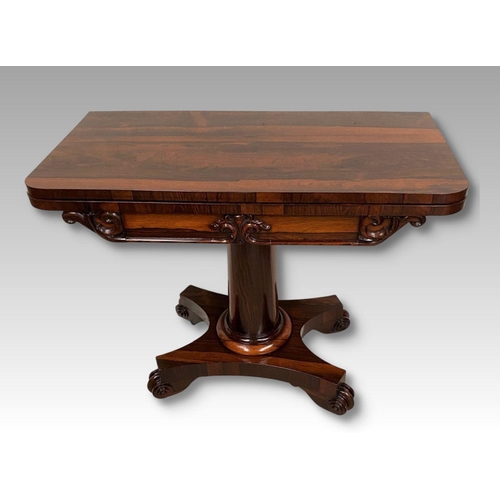 4 - A WILLIAM IV ROSEWOOD CARD TABLE, with lift top opening to navy blue baize, shaped engraved scroll f... 