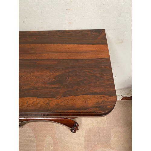 4 - A WILLIAM IV ROSEWOOD CARD TABLE, with lift top opening to navy blue baize, shaped engraved scroll f... 