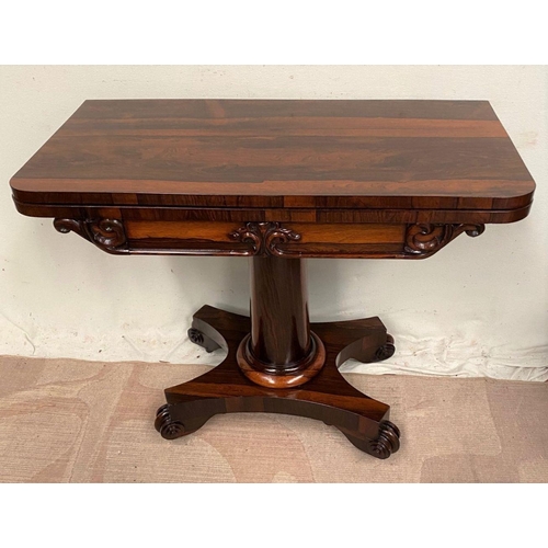 4 - A WILLIAM IV ROSEWOOD CARD TABLE, with lift top opening to navy blue baize, shaped engraved scroll f... 