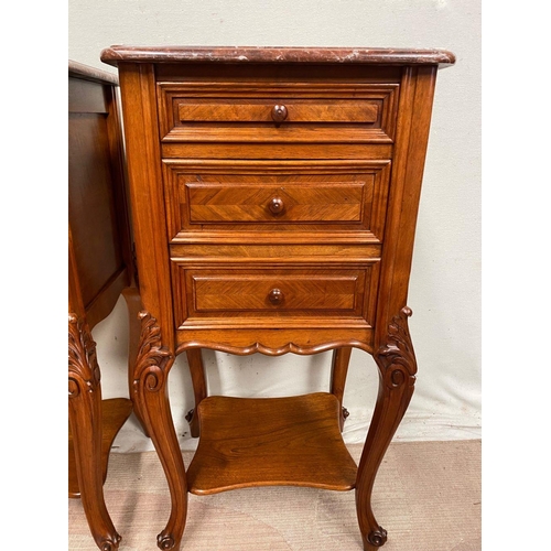 43 - A GREAT PAIR OF MARBLE TOPPED WALNUT THREE DRAWER CABINETS, the graduated three drawer cabinet raise... 