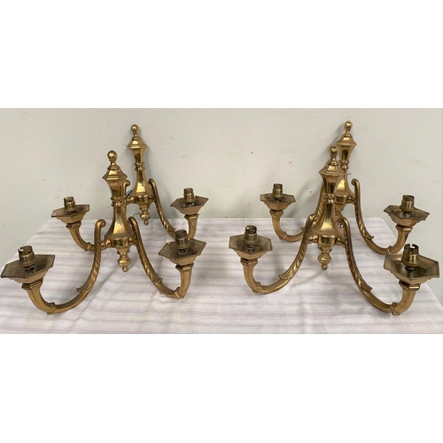 45 - A SET OF FOUR TWO ARM BRASS WALL SCONCE LIGHTS, good heavy brass set. 40cm wide x 33cm tall.