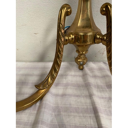 45 - A SET OF FOUR TWO ARM BRASS WALL SCONCE LIGHTS, good heavy brass set. 40cm wide x 33cm tall.