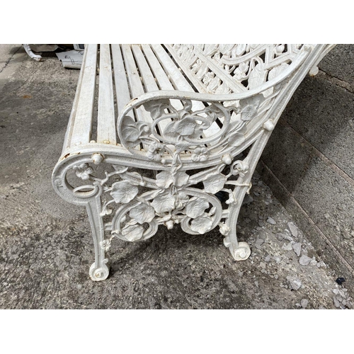 5 - A WHITE CAST IRON COALBROOKDALE STYLE GARDEN SEAT, ‘Nasturtium’ pattern to back, naturalistic scroll... 