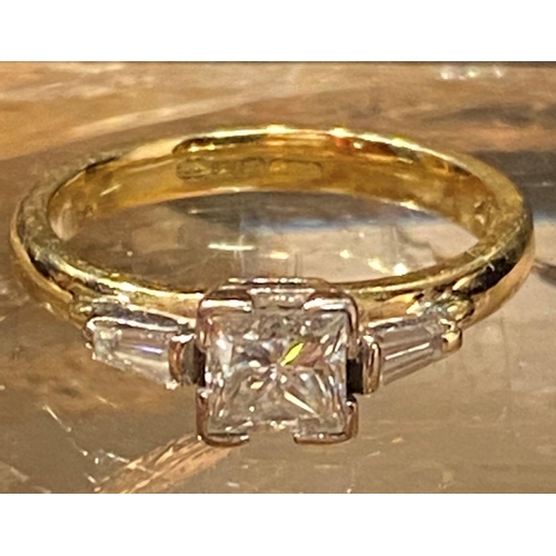 57 - A STRIKING 18CT YELLOW GOLD PRINCESS CUT DIAMOND SOLITAIRE RING, with tapered baguette diamond shoul... 