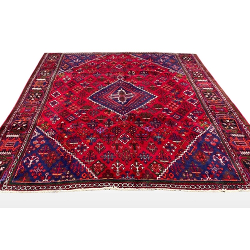 6 - A PERSIAN JOSHAGAN RUG, material: hand spun wool with natural organic dyes; design: this rug feature... 