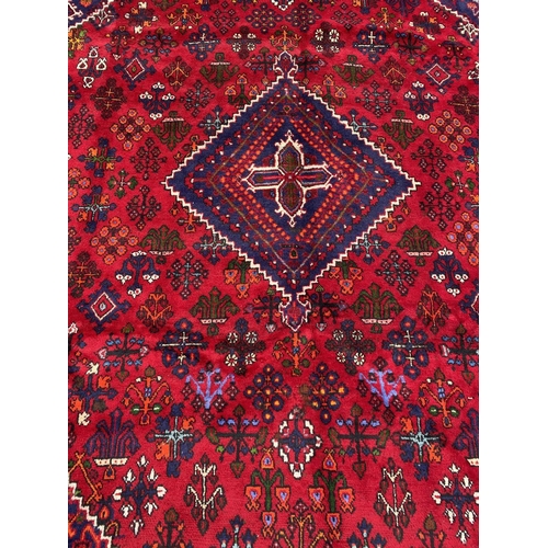 6 - A PERSIAN JOSHAGAN RUG, material: hand spun wool with natural organic dyes; design: this rug feature... 