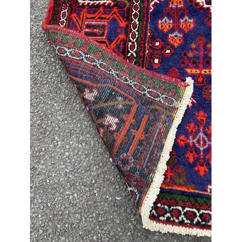 6 - A PERSIAN JOSHAGAN RUG, material: hand spun wool with natural organic dyes; design: this rug feature... 