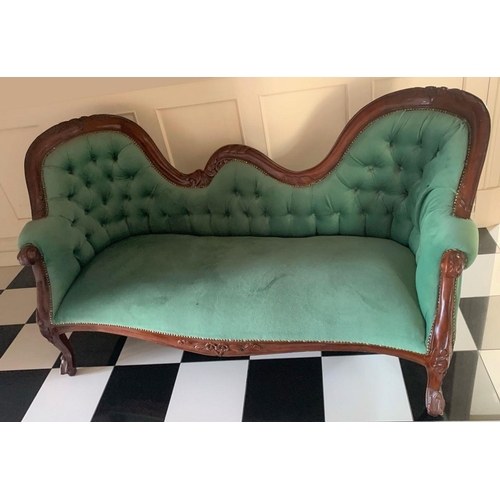 64 - A MAHOGANY UPHOLSTERED CHAISE LOUNGE, unique scroll mahogany frame, upholstered with green button ba... 