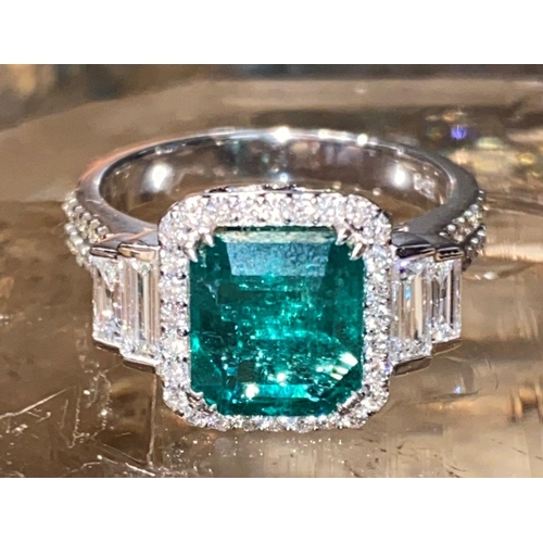 67 - AN EXCEPTIONAL 18CT WHITE GOLD NATURAL COLUMBIAN EMERALD AND DIAMOND CLUSTER RING, natural Colombian... 