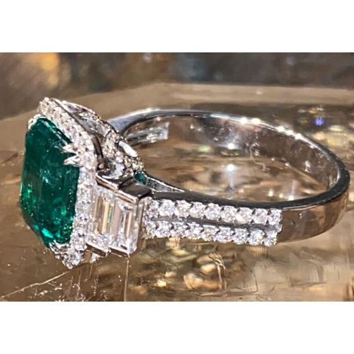 67 - AN EXCEPTIONAL 18CT WHITE GOLD NATURAL COLUMBIAN EMERALD AND DIAMOND CLUSTER RING, natural Colombian... 