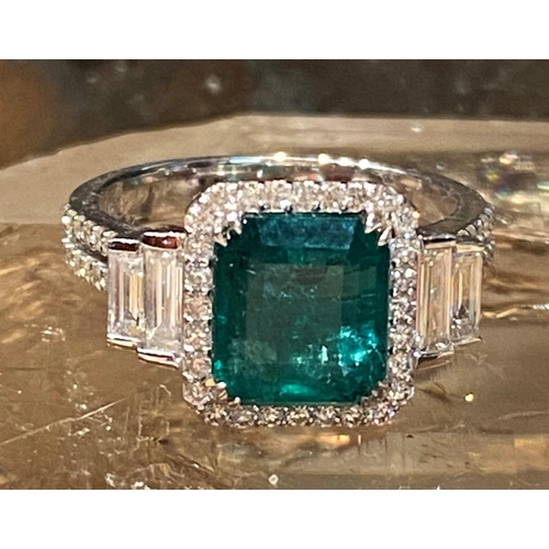 67 - AN EXCEPTIONAL 18CT WHITE GOLD NATURAL COLUMBIAN EMERALD AND DIAMOND CLUSTER RING, natural Colombian... 