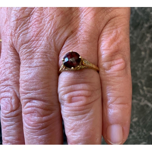 70 - AN 18CT YELLOW GOLD RUBY & DIAMOND RING, with a lovely dark ruby set in 18ct with 34 diamonds set on... 