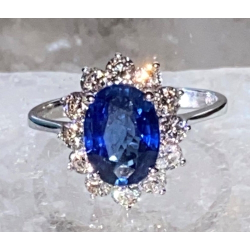 85 - AN 18CT WHITE GOLD CEYLON SAPPHIRE AND DIAMOND CLUSTER RING, oval Ceylon sapphire weight: 3.50cts, s... 