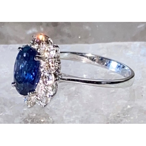 85 - AN 18CT WHITE GOLD CEYLON SAPPHIRE AND DIAMOND CLUSTER RING, oval Ceylon sapphire weight: 3.50cts, s... 