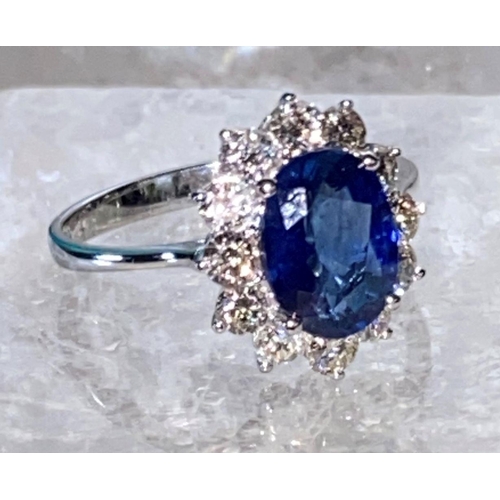 85 - AN 18CT WHITE GOLD CEYLON SAPPHIRE AND DIAMOND CLUSTER RING, oval Ceylon sapphire weight: 3.50cts, s... 