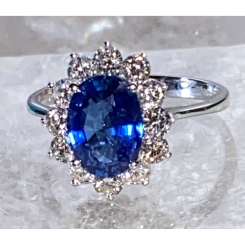 85 - AN 18CT WHITE GOLD CEYLON SAPPHIRE AND DIAMOND CLUSTER RING, oval Ceylon sapphire weight: 3.50cts, s... 