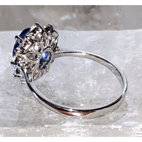 85 - AN 18CT WHITE GOLD CEYLON SAPPHIRE AND DIAMOND CLUSTER RING, oval Ceylon sapphire weight: 3.50cts, s... 