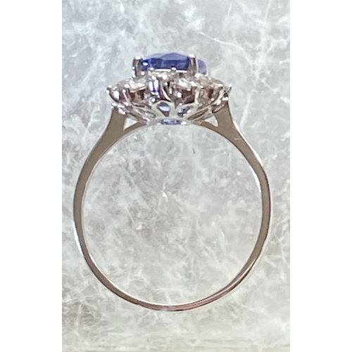 85 - AN 18CT WHITE GOLD CEYLON SAPPHIRE AND DIAMOND CLUSTER RING, oval Ceylon sapphire weight: 3.50cts, s... 