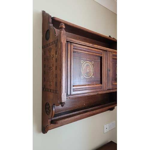 90 - A LATE 19TH / EARLY 20TH CENTURY CARVED & PAINTED OAK HANGING WALL CABINET, in the style of Bruce Ta... 