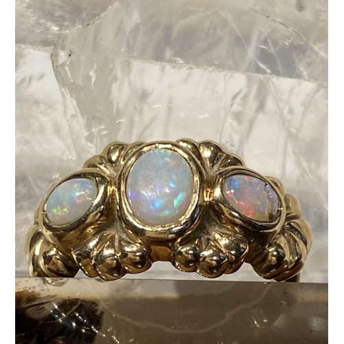 91 - A 9CT YELLOW GOLD EXQUISITE THREE STONE FIRE OPAL RING, the opals are in a bezel setting and surroun... 