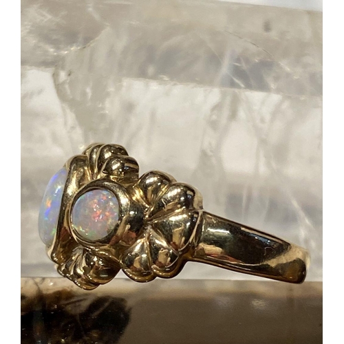 91 - A 9CT YELLOW GOLD EXQUISITE THREE STONE FIRE OPAL RING, the opals are in a bezel setting and surroun... 