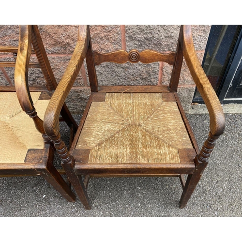 95 - TWO SOLID GEORGIAN ARMCHAIRS, both with cane seats, with carved back splats, turned armrests, suppor... 