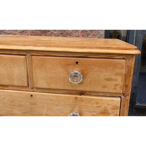 96 - A VICTORIAN PINE CHEST OF DRAWERS, with two drawers over two, all with cut glass handles, raised on ... 