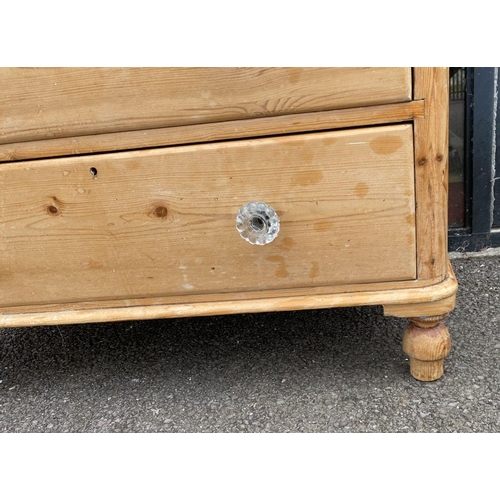 96 - A VICTORIAN PINE CHEST OF DRAWERS, with two drawers over two, all with cut glass handles, raised on ... 