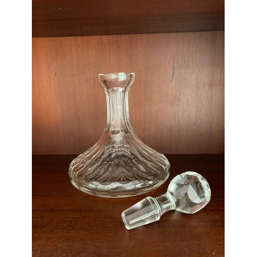 107 - A GOOD QUALITY CUT GLASS SHIPS DECANTER, with stopper, the body decorated with broad fluted cuts and... 