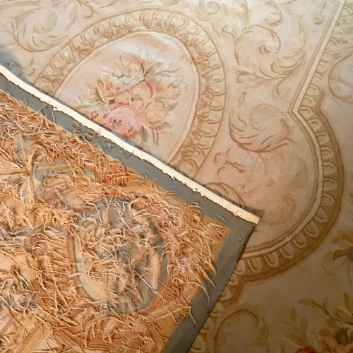 108 - A GOOD QUALITY WOVEN AUBUSSON FLOOR RUG, with a central medallion with floral bouquet, the main body... 